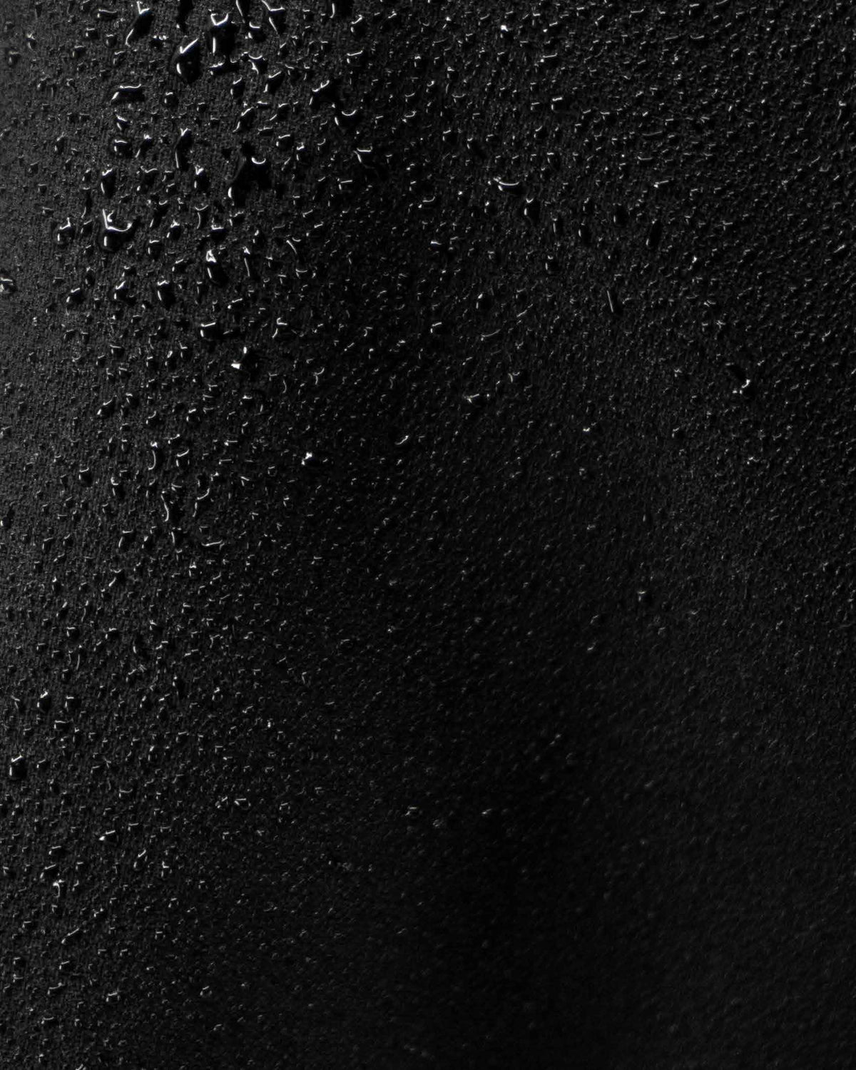 Close-up of SuperCell™ fabric beaded with water droplets